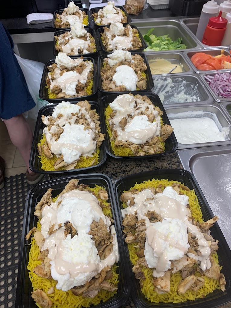 Catering trays of chicken and rice ready for pickup