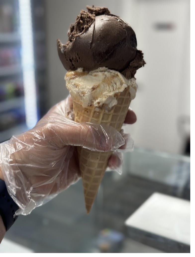 Double scoop ice cream cone, chocolate and caramel swirl